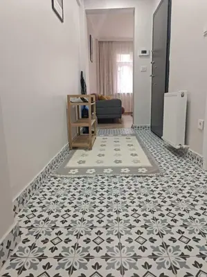 a living room with a tile floor in a room at Evinizin Konforunu Yaşayın ! in Istanbul