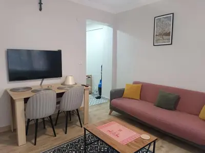 a living room with a couch and a table at Evinizin Konforunu Yaşayın ! in Istanbul