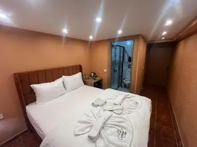a bedroom with a bed with towels on it at Cemre Homes in Istanbul