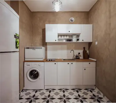 a kitchen with a washing machine and a washer at Raya Suites in Istanbul