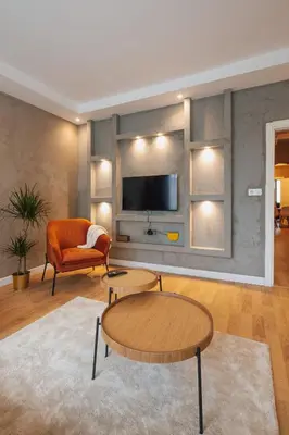 a living room with a couch and a tv at Raya Suites in Istanbul