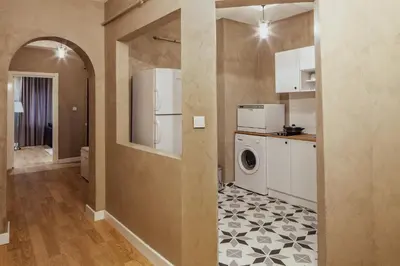 a kitchen with a refrigerator and a washer and dryer at Raya Suites in Istanbul