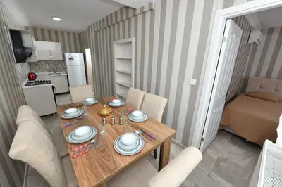 a dining room table with plates on top of it at Dogancay Suite in Istanbul
