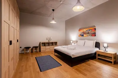 a bedroom with a bed and a table and chairs at Beautiful Deluxe 1BD Condo PoolGymParking! #373 in Istanbul