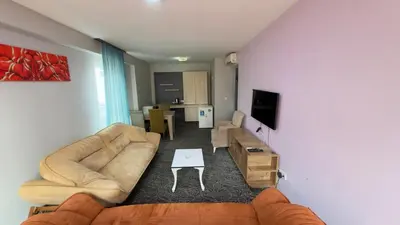 a living room with a couch and a table at Güven Suit in Esenyurt