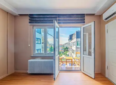 a room with a large window and a radiator at Palas Apartments in Istanbul