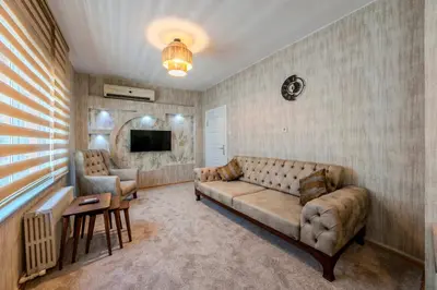a living room with a couch and a table at Palas Apartments in Istanbul