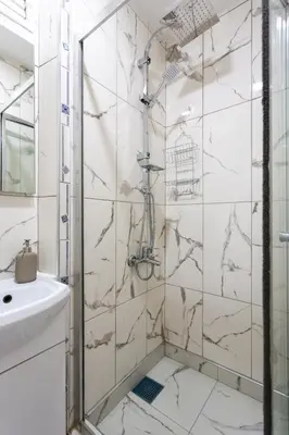 a bathroom with a shower and a sink at Lovely and Snug Flat, Just Steps from Istiklal Street in Istanbul