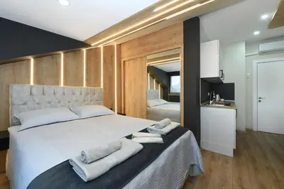 a bedroom with a large bed with towels on it at Space Apartments in Istanbul