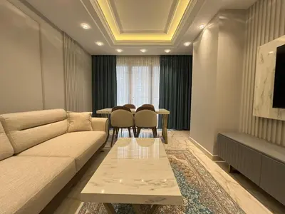 a living room with a couch and a table at Ruzi's House in Istanbul