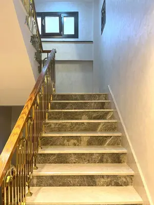 a staircase in a building with wooden railings at Ruzi's House in Istanbul