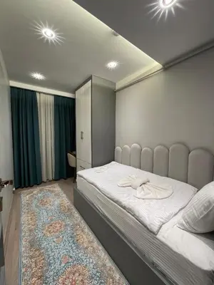 a bedroom with a large bed and a rug at Ruzi's House in Istanbul