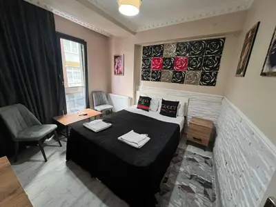 a small room with a bed and a table at Neo Suit I Hotel in Istanbul