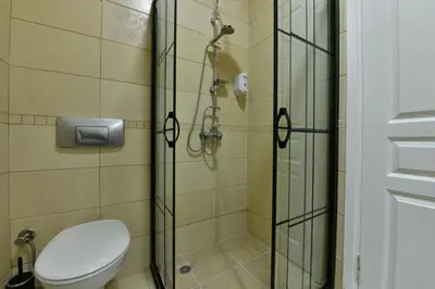 a bathroom with a toilet and a shower at Bomonti Apartments in Istanbul