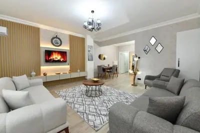 a living room with two couches and a fireplace at VIP Apartment in Istanbul
