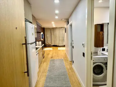 a kitchen with a washer and dryer in a room at İstanbul buluşma noktası in Istanbul