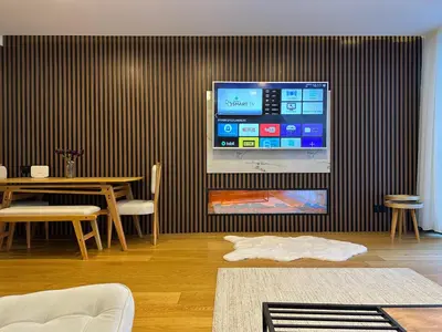 a room with a table and a tv on a wall at İstanbul buluşma noktası in Istanbul