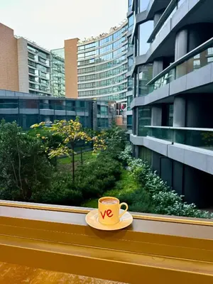 a cup of coffee sitting on a window sill at İstanbul buluşma noktası in Istanbul