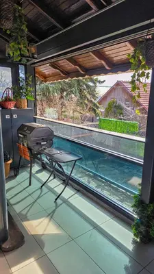 a grill on a table next to a swimming pool at Uludag Tatil Evleri & Villa Dogus Uludağ in Bursa