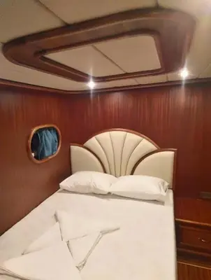 a bed in the corner of a room on a boat at Hans Beys yatch in Istanbul