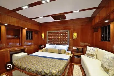 a bedroom in a boat with a bed and a couch at Hans Beys yatch in Istanbul
