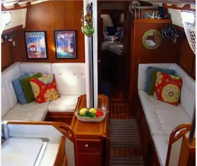 a boat with two couches and a bowl of fruit on a table at Hans Beys yatch in Istanbul
