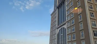 a tall building with a blue sky in the background at ميدوكليه بشاك شهير 1 in Istanbul