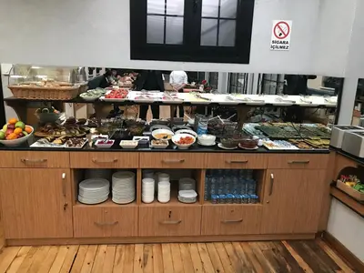 a buffet line with plates and other food items at Aybar Hotel & Spa in Istanbul
