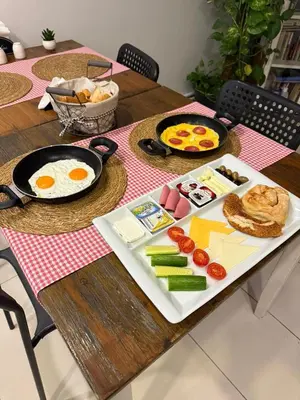 a breakfast table with eggs and vegetables on a table at The Print House Hotel in Istanbul