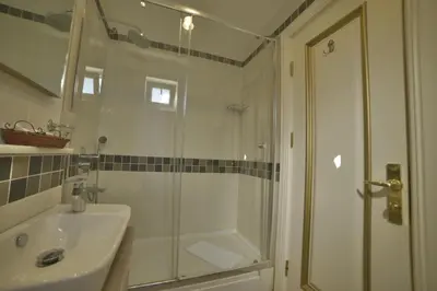 a bathroom with a shower and a sink at Sarnic Hotel & Sarnic Premier Hotel(Ottoman Mansion) in Istanbul