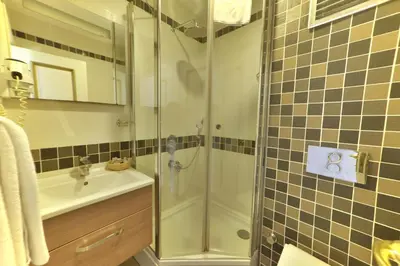 a bathroom with a shower and a sink at Sarnic Hotel & Sarnic Premier Hotel(Ottoman Mansion) in Istanbul