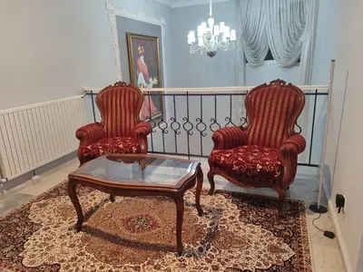 two chairs and a coffee table in a living room at Kilyos Serendipity in Sarıyer