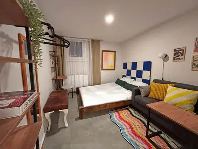 a living room with a bed and a couch at Central 5 Bedroom 5 Bathroom, Newly Renovated Villa at the heart of the city in Istanbul