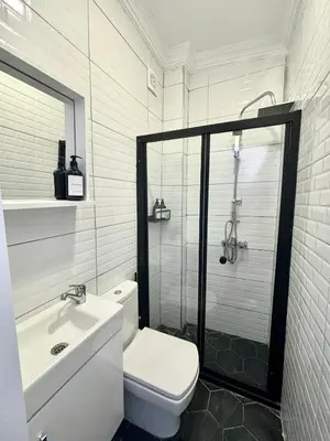 a bathroom with a shower and a toilet and a sink at Central 5 Bedroom 5 Bathroom, Newly Renovated Villa at the heart of the city in Istanbul