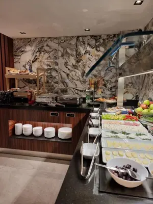 a buffet line with plates of food in a restaurant at RIJJI HOTEL ISTANBUL OLD CiTY in Istanbul