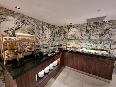 a kitchen with a counter with food on it at RIJJI HOTEL ISTANBUL OLD CiTY in Istanbul