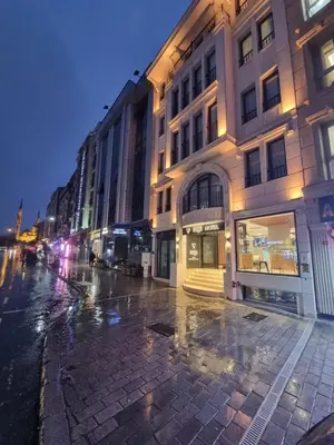 an empty city street at night with a building at RIJJI HOTEL ISTANBUL OLD CiTY in Istanbul