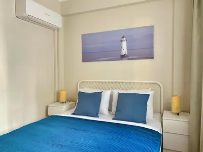 a bedroom with a bed with a lighthouse at Spacious & City Center 3 Bedroom Flat - No2 in Istanbul