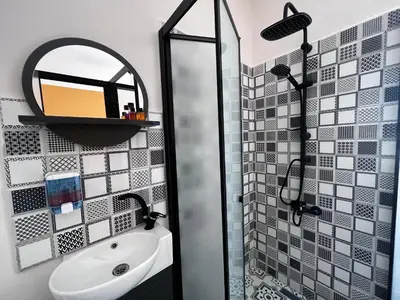 a bathroom with a shower and a sink and a mirror at Astounding Sea View Apartment in Karaköy 4BR, 2BA in Istanbul
