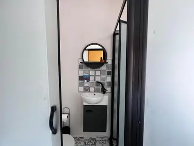 a small bathroom with a sink and a mirror at Astounding Sea View Apartment in Karaköy 4BR, 2BA in Istanbul