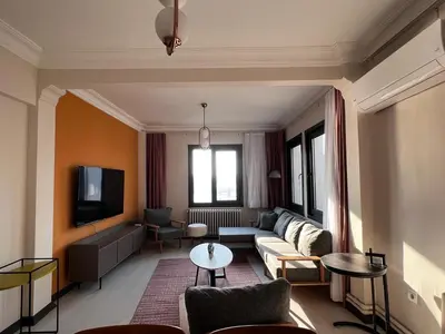 a living room with a couch and a tv at Astounding Sea View Apartment in Karaköy 4BR, 2BA in Istanbul