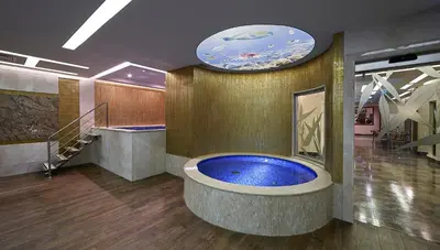 a large bathroom with a large blue tub at Uranus Istanbul Topkapi in Istanbul