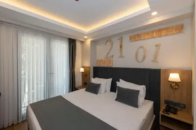a bedroom with a large bed with two pillows at Harmony Hotel Istanbul & SPA in Istanbul
