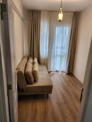 a living room with a couch and a window at KADIKOY merkezi konumda in Istanbul
