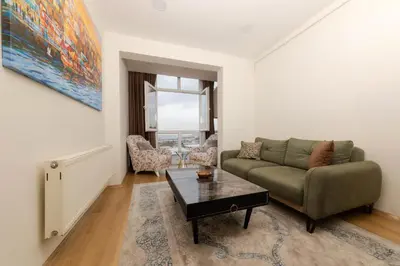 a living room with a couch and a table at Algold in Istanbul