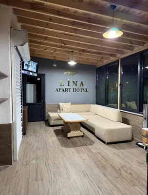 a living room with a couch and a table at Lina Apart in Arnavutköy