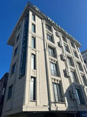 a building with a sign on the side of it at The walens hotel in Istanbul