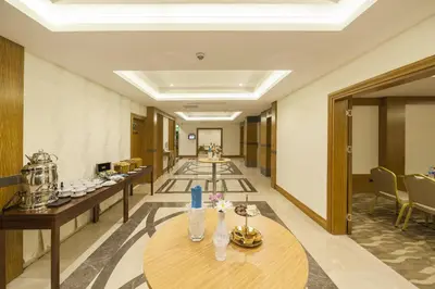a corridor of a hotel with tables and chairs at Lamec Hotel Business in Gebze