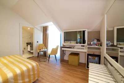 a bedroom with a bed and a desk in a room at Icon Hotel Taksim in Istanbul