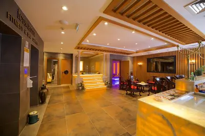 a lobby with a restaurant with a table and chairs at Icon Hotel Taksim in Istanbul